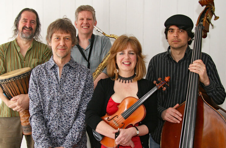 Members of Flatword, 4 men and 1 woman and their instruments