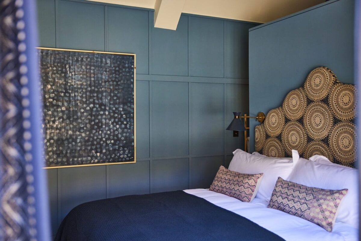 A blue panelled bedroom