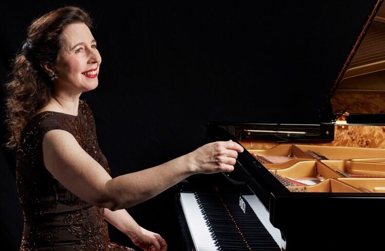 Angela Hewitt seated at the piano