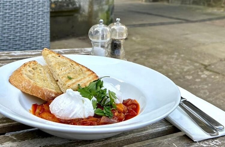 A dish from Mac and Jac's served outside at wooden table