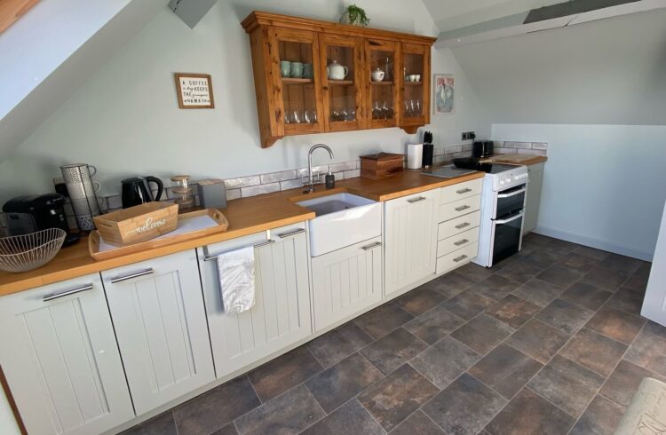 Kitchen with oven and hob, sink and other appliances