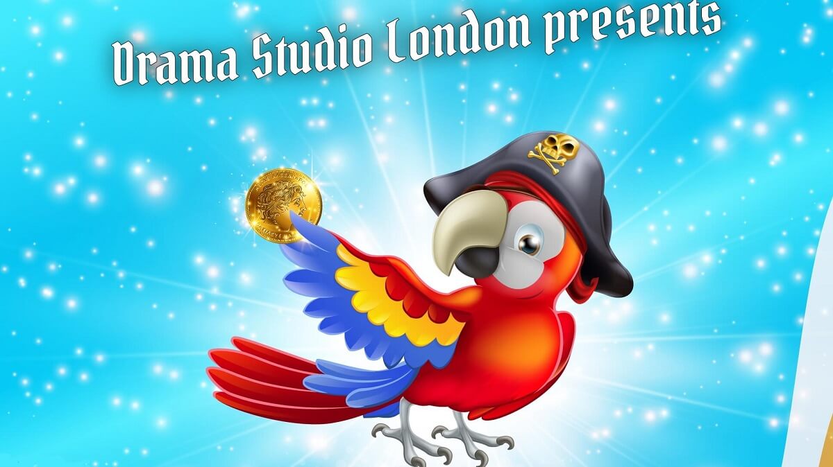 A parrot wearing a pirates hat and holding a gold coin