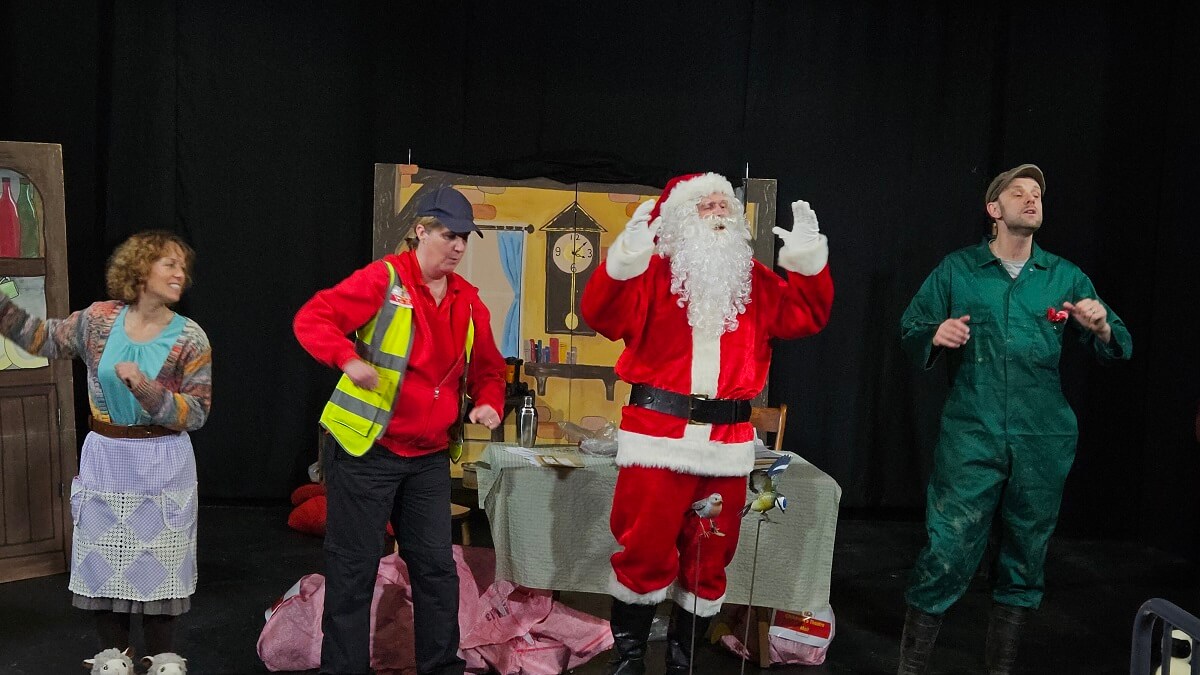 Four actors rehearsing for the play 'A Surprise for Farmer Christmas'