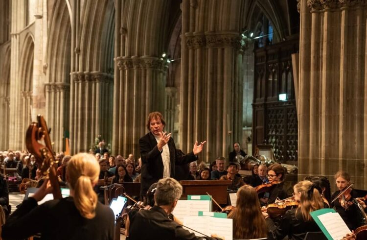 A conductor and orchestra in Worcester Cathedral as part of the Elgar Festival (image copyright Michael Whitefoot)